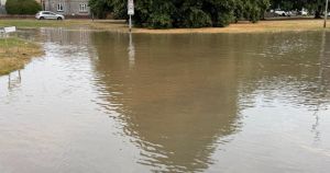 Burst water main causes severe flooding and road closures in town