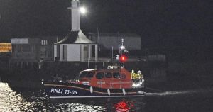 Lifeboat aids vessel in difficulties with ropes around both propellers