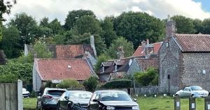 Norfolk parish council forced to act after cars park on blind bend