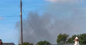 Road blocked as crews tackle garden blaze in seaside village