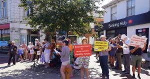 Crowd gathers to demand reopening of closed NHS facility