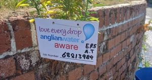 Water pours from wall as burst main woe continues on town road