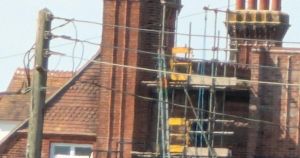 Man taken to hospital after falling 26 feet from school scaffolding