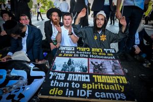 ‘Make the earth shake’: Haredi protesters don yellow stars, block roads after draft evader’s arrest