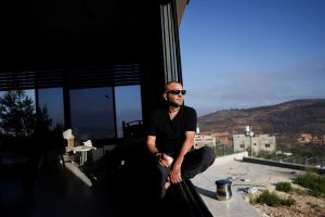 Israeli settler berates Palestinian American near his besieged West Bank home