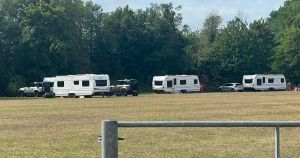 Travellers arrive in park after getting through locked gate