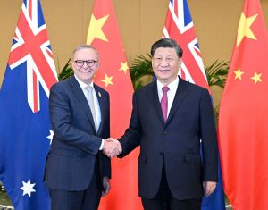 Australia should work with China, not try to contain it