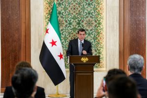 Syrian Kurdish leader says armed force dissolved, capping integration with Damascus