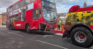 Double-decker bus which crashed into home removed as investigation launched
