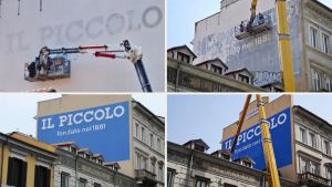 Un pezzo di storia ritrovato: la rinascita dell'insegna del «Piccolo» sul murale in piazza Goldoni