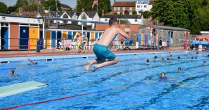 Summer's here to stay as record crowds spark first-ever 28C festive swim season