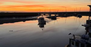 Person pulled from the water after falling off quay