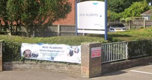 High school praised for academic progress...but urged to improve attendance