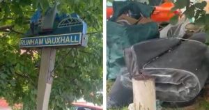 Fly-tipped rubbish cleared after threatening to hide village sign