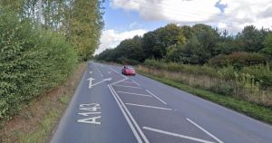 Delays on major road after bus and tractor crash