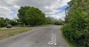 Road closed after air ambulance attends crash involving car and motorcyclist