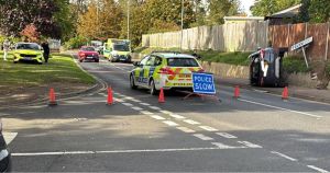 Two taken to hospital after car ends up on side in crash