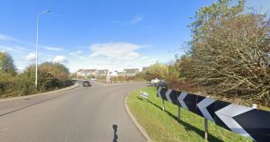 Emergency services at scene of crash on busy roundabout near A11