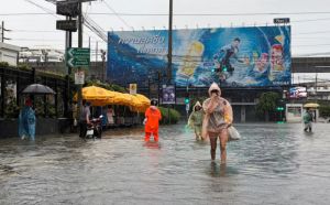 Heavy rain floods Bangkok homes and roads as city declared disaster zone