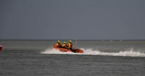 Pair rescued after being stranded by fast-rising tide