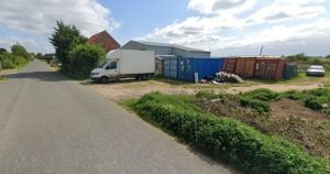 Sheds and shipping containers on edge of village could make way for new homes