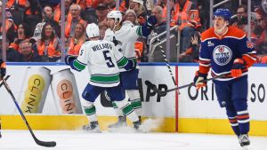 Cotter's eye-opening performance helps rebuilding Canucks stun Oilers