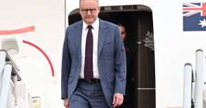 PM leaves grim domestic scene as he flies to Pacific