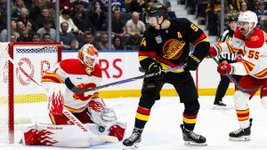 Overturned call turns tide as Flames squander lead against Canucks