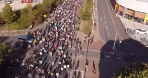 Drone footage shows thousands descending on city streets for last-minute bike rave