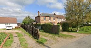 Bid to keep containers and caravan sited on land without planning permission