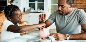 Canada and the U.S. are giving children money to build savings. But the rules on keeping it are very different