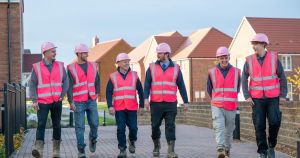 King’s Lynn construction team swaps hi-vis for pink PPE to raise £200 for charity