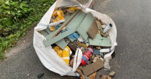 Bag of rubbish including fire extinguisher dumped in road 'likely by man with van'